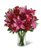 A beautiful mix of roses and lilies in deep red and pink!